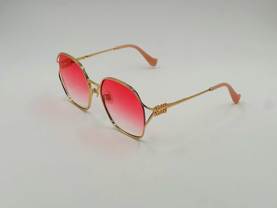Miu Miu rose gold hexagonal sunglasses with coral gradient lens