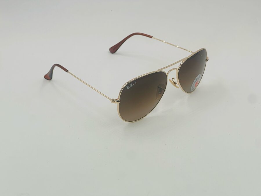 Ray-Ban gold round metal sunglasses with teal lens